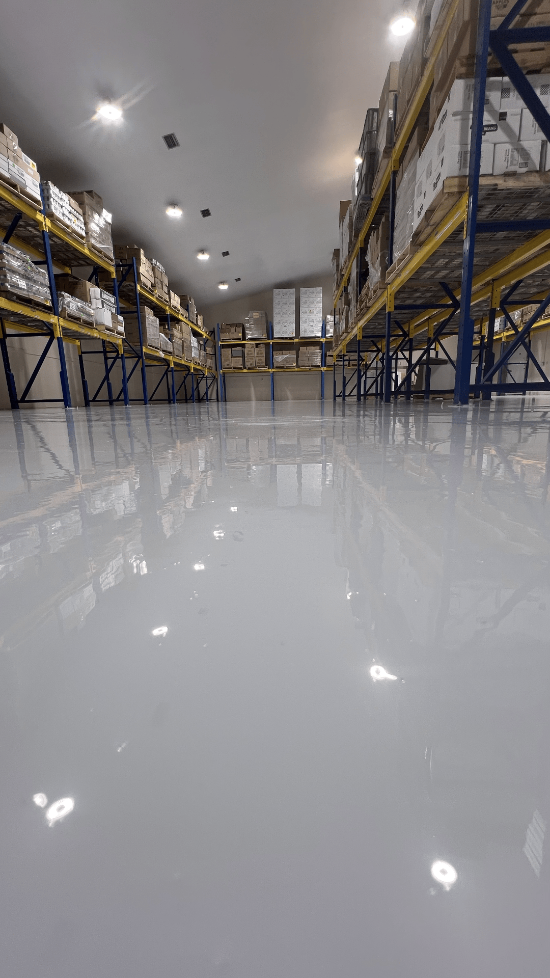 Industrial epoxy floor coating in a warehouse facility